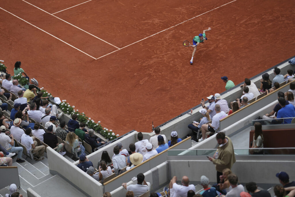 Players competing in intense matches at Roland Garros, showcasing thrilling tennis action and determination.