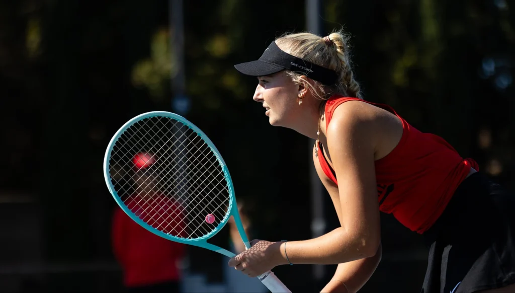 Aryna Sabalenka celebrates advancing in women's tennis at Roland Garros quarterfinals, showcasing her top player status.