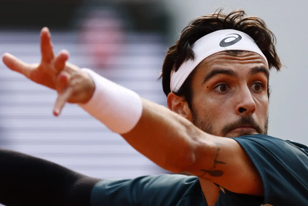 Lorenzo Musetti accidentally kicks a ball hitting a line-judge during his French Open quarter-final match.